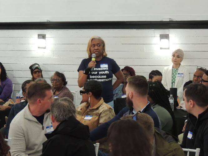 Community member speaking at the 170-person Public Safety Listening Session