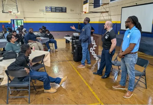 CJ speaking to youth at a school forum